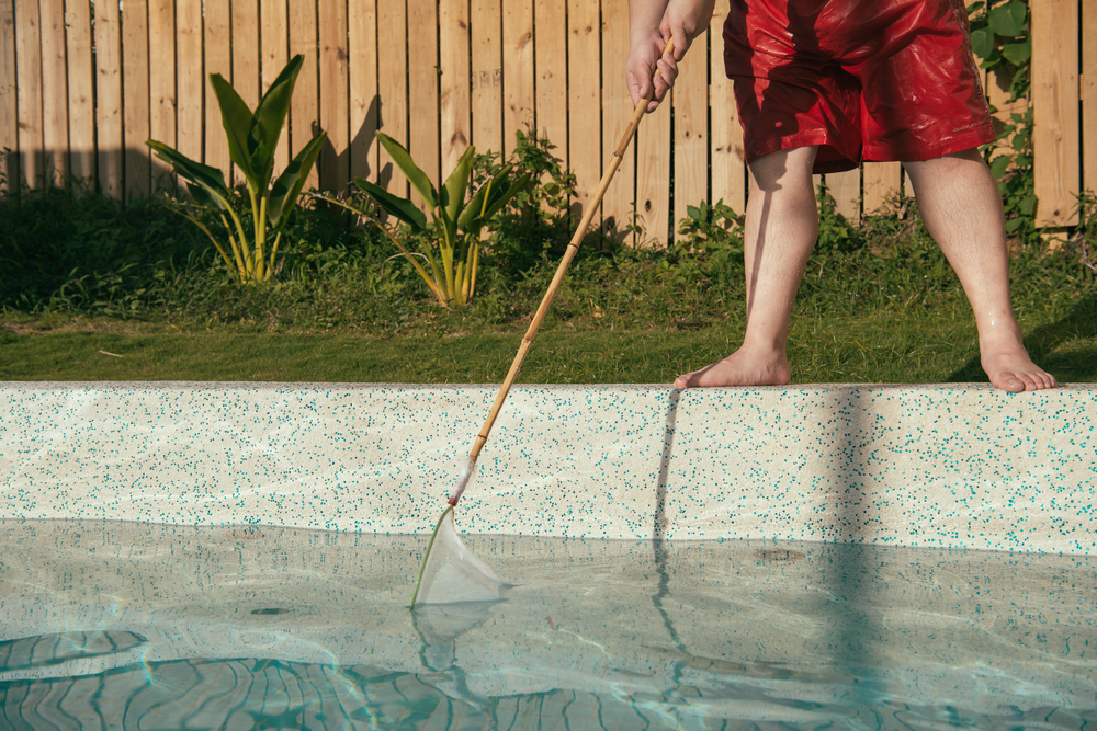 cleaning the bottom of the pool